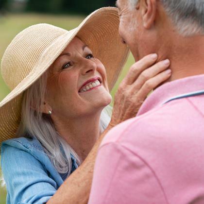 Senior couple sharing a romantic moment outdoors