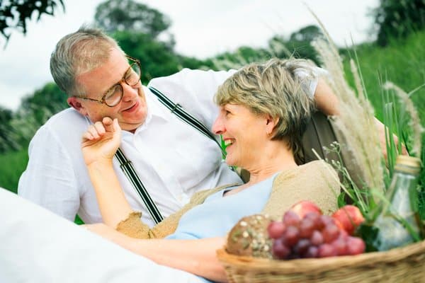Senior couple enjoying relaxed companionship after 60 outdoors